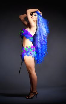 Woman in Blue Wig and Dress of Feathers