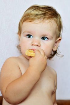 toddler funny girl eating  sweet cake