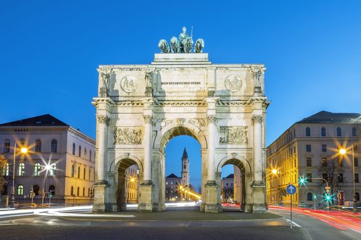 The Siegestor (english: Victory Arch) in Munich. This is a long exposure at dusk with traffic going around the arch