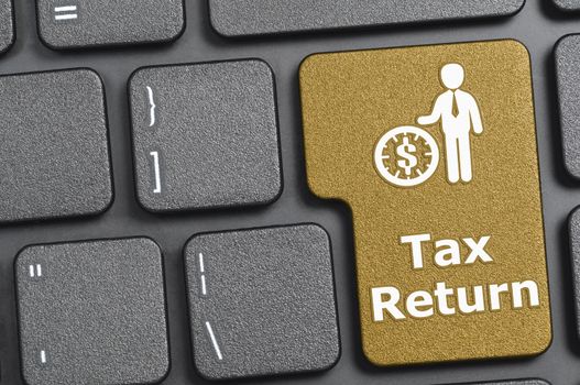 Brown tax return key on keyboard