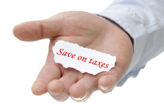 Business man holding save on taxes note on hand