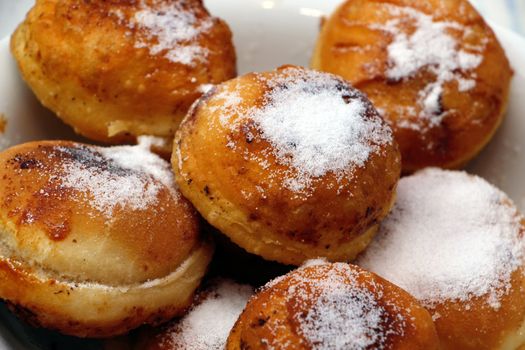 Powdered donuts in bowl