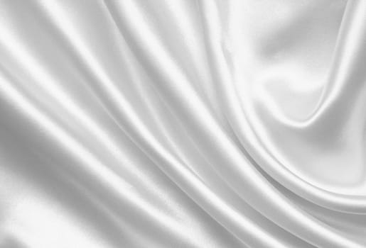 Smooth elegant white silk or satin can use as wedding background 