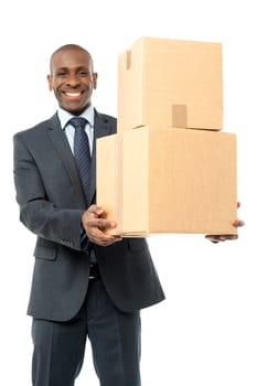 Middle aged corporate man holding stack of boxes