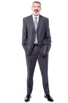 Full length of businessman standing over white
