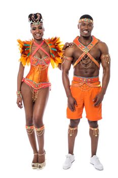 Samba dancers posing to camera over white