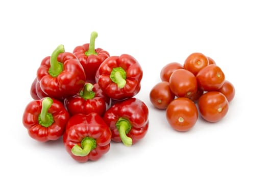 fresh vegetables - tomatoes and peppers on white background