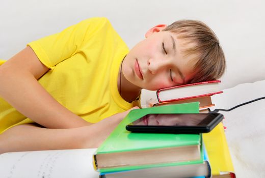 Tired Kid sleep with the Books on the Bed