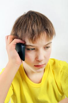 Sad Kid with Cellphone on the White Background