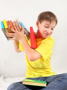 Teenager throw out the Books on the White Wall Background