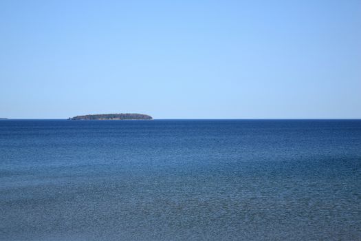 Grassy Michigan shoreline and beach of North American Great Lake Superior.