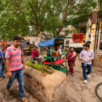 Blurred background of people walk in the street