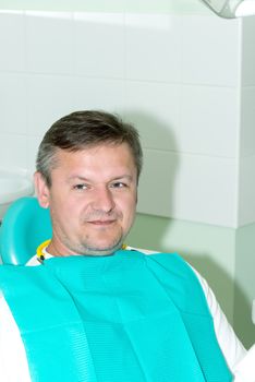 Portrait of a man in dentist office