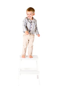 Boy in shirt shot in the studio on a white background