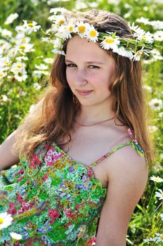 romantic teen girl on the daisy meadow