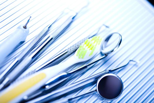 Dentist equipment on blue background