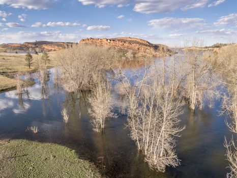 aerial view of Horsetooth Reservoir near Fort Collins Colorado, early spring with high water level and cottonwood trees in water