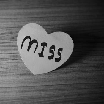 black and white paper heart write miss word