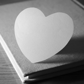 black and white paper heart with notebook