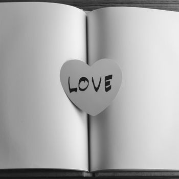 black and white paper heart write love word word