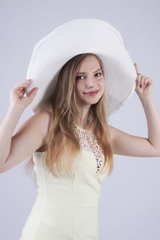 smiling young lady in white hat