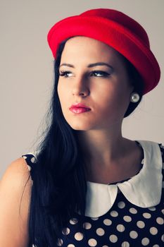 Young woman with red hat, the dress with dots