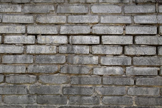 Brick wall with regular texture gray