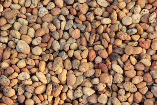 Pile of round peeble stones for background