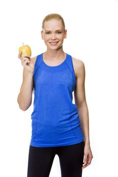 blonde smiling woman wearing fitness clothing and holding an apple