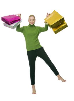 blonde smiling woman with gift bags jumping
