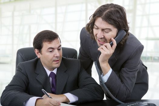 business team working at a desk, at the office