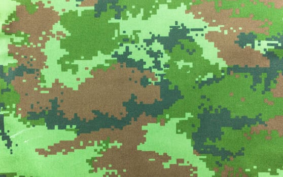 Digital graphic military camouflage fabric background texture .