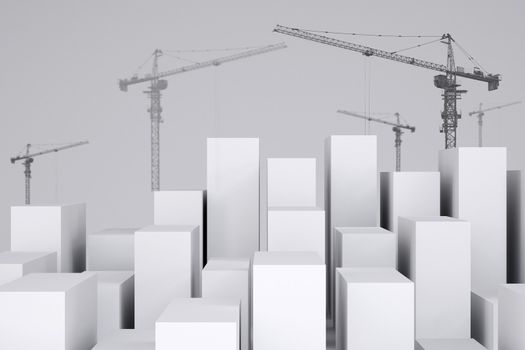 White cubes with wire-frame tower cranes on gray background. Cropped image. Concept of urban construction