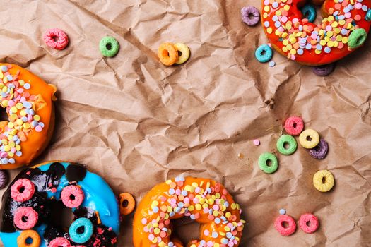 Colorful donuts on a wrinkled paper