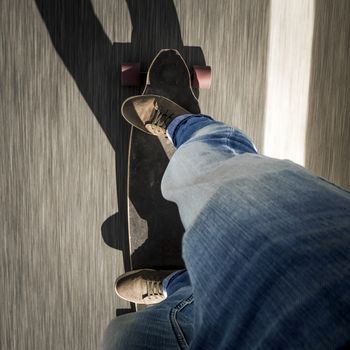 Detail of a young man feet riding a skateboard