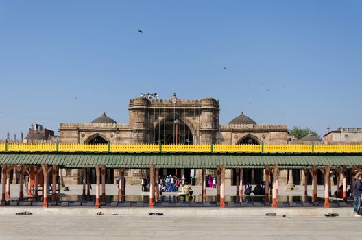 Ahmedabad, India - December 28, 2014: Tourist visit Jama Masjid also known as Jami or Jumma Mosque, is the most splendid mosque of Ahmedabad, built in 1424 during the reign of Ahmed Shah I.