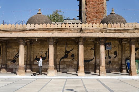 Ahmedabad, India - December 28, 2014: Muslim people at Jama Masjid also known as Jami or Jumma Mosque, is the most splendid mosque of Ahmedabad, built in 1424 during the reign of Ahmed Shah I.