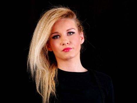 beautiful blonde woman wearing black shirt, posing, studio shot  