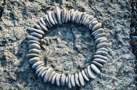 Sequence of small stones laid out in the form of a circle