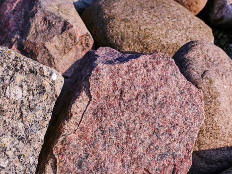 Big cracked stones in the Baltic beach