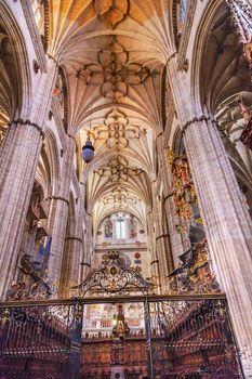 Stone Columns Choir Stalls New Salamanca Cathedral Spain.  The New and Old Cathedrals in Salamanca are right next to each other.  New Cathedral was built from 1513 to 1733 and commissioned by Ferdinand V of Castile, Spain.