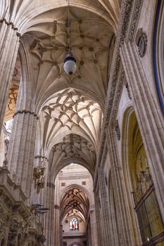 Stone Columns Angels and Mary Statues New Salamanca Cathedral Spain.  The New and Old Cathedrals in Salamanca are right next to each other.  New Cathedral was built from 1513 to 1733 and commissioned by Ferdinand V of Castile, Spain.