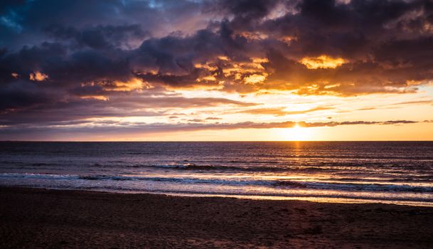 Bright sunset at the Baltic sea beach