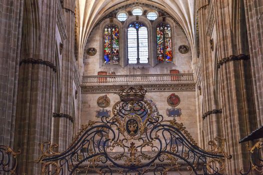 Stone Columns Crest Stained Glass Salamanca New Cathedral Castile Spain. The New and Old Cathedrals in Salamanca are right next to each other.  New Cathedral was built from 1513 to 1733 and commissioned by Ferdinand V of Castile, Spain.