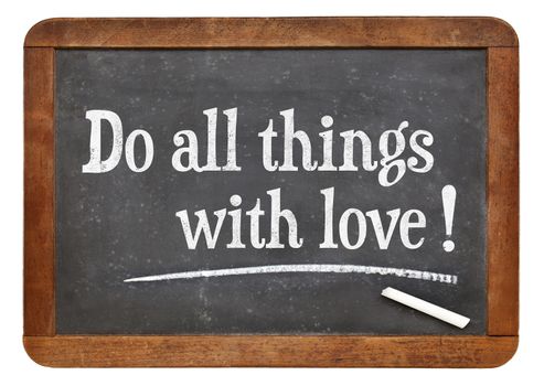 Do all things with love - positive words on a vintage slate blackboard