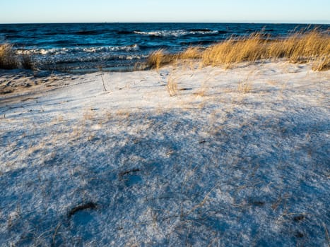 Winter landscape in Baltic sea beach cowered with show
