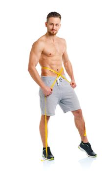 Sport man with measuring tape on the white background