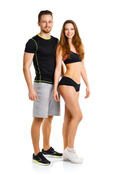 Sport couple - man and woman after fitness exercise on the white background