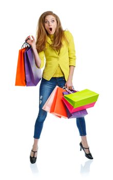 Happy lovely woman with shopping bags over white background