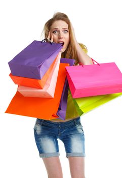 Happy lovely woman with shopping bags over white background